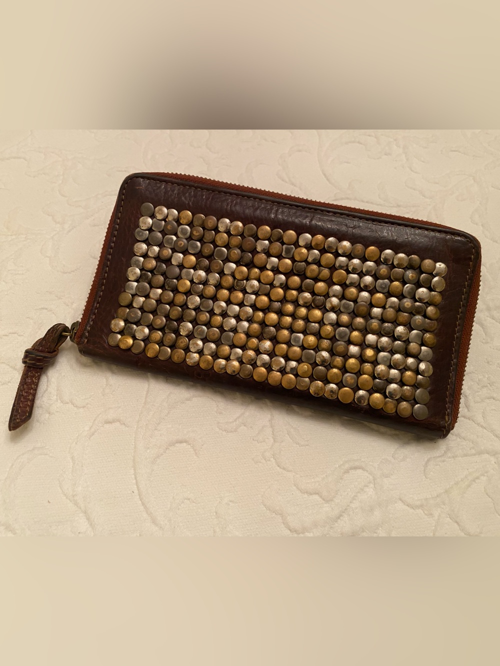 Metal studded brown leather wallet from CowboysBag, Switzerland